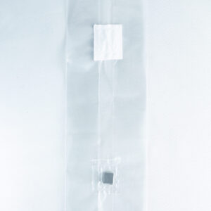 A clear plastic Mushroom Grow Bag Unicorn for spawn and substrate, featuring two small compartments with items inside, is displayed on a white background.