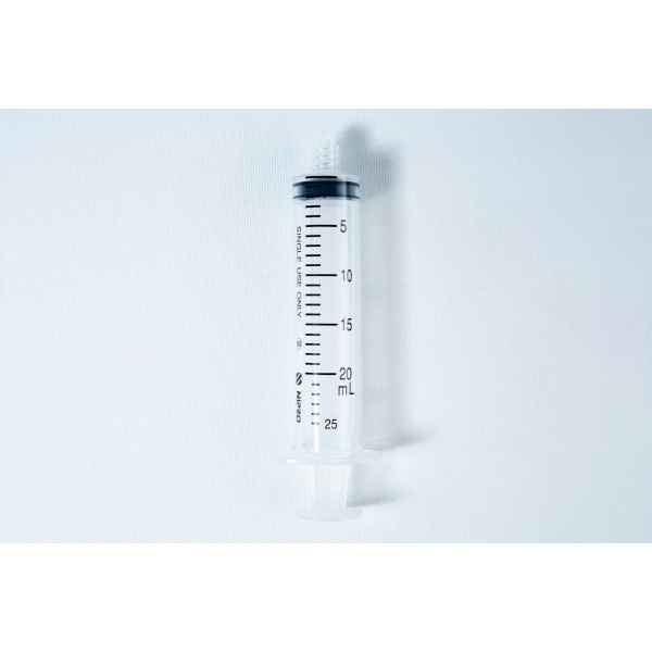 A clear, empty plastic syringe with black measurement markings up to 25 mL on a white background.