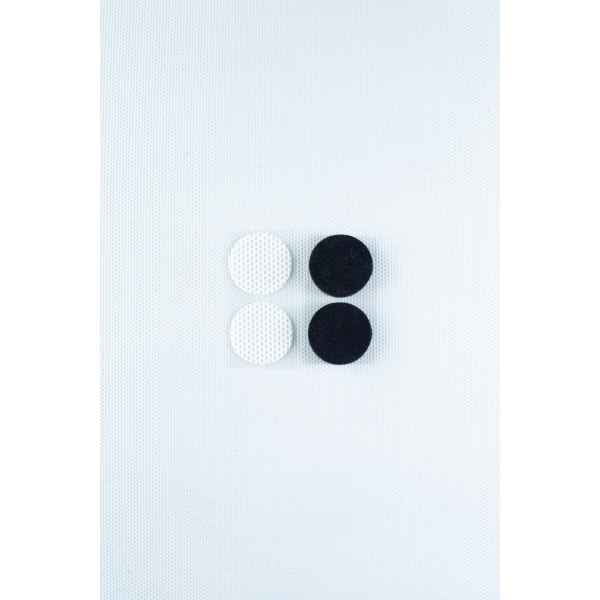 The Self-healing injection port & Air Vent Filter-3M, featuring two white and two black textured components, is arranged in a square on a light textured background.