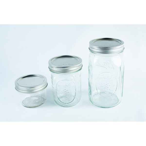 Three empty wide-mouthed glass Mason jars, each featuring an 86mm metal lid and band set, are arranged on a white background.