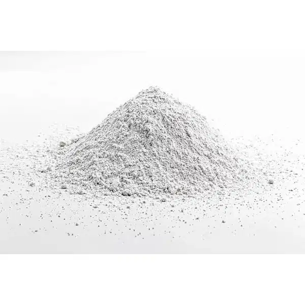 A small mound of Calcium Carbonate for Mycology, a fine white powder, is scattered on a plain white surface.