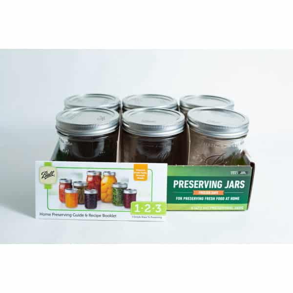 Ball Mason pint jars wide mouth set of 6 includes a box and a booklet with colourful preserved foods pictured in jars on the cover.