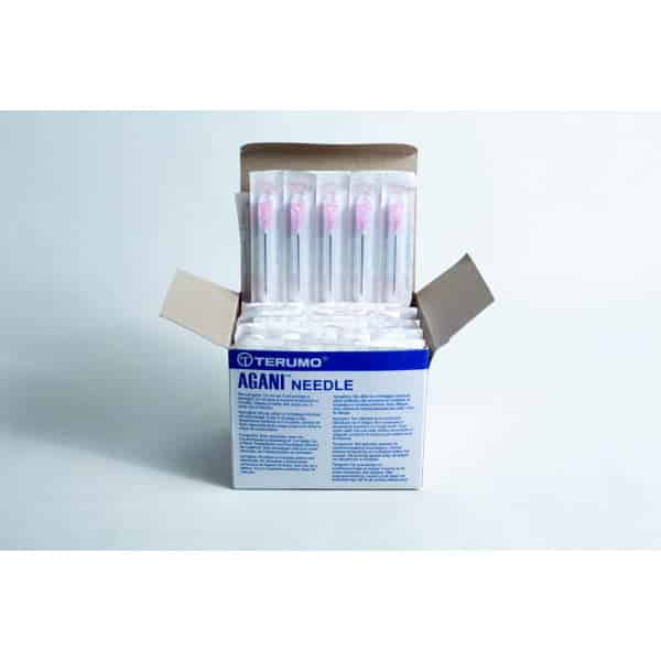 Open box of sterile 18G hypodermic needles whole box 100pcs, showing several individually wrapped sterile needles inside.