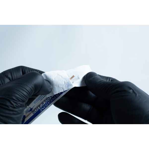 Gloved hands open an antiseptic wipe packet against a plain background, preparing the agar Petri dish MEA School Science Fun Project Kit for a school science activity.