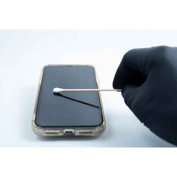 A gloved hand cleans a smartphone screen with a cotton bud, resembling the precise care used in school science projects with the Agar petri dish MEA School Science Fun Project Kit.