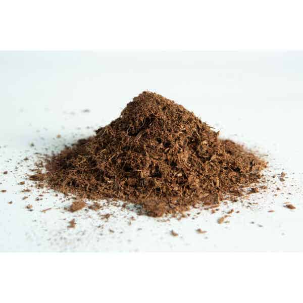 A small pile of coco coir block 5 kg, 60L, washed of salts buffered RHP grade on a white surface.