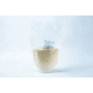 A transparent pouch of Liquid Culture Pre-mix | DLME | Now Extra Clear, containing light yellow dextrose and light malt extract powder, with a small silica gel sachet inside.