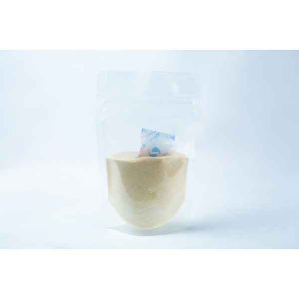 A transparent pouch of Liquid Culture Pre-mix | DLME | Now Extra Clear, containing light yellow dextrose and light malt extract powder, with a small silica gel sachet inside.