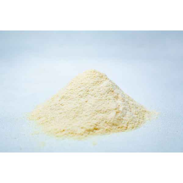 A small mound of pale yellow Liquid Culture Pre-mix | DLME | Now Extra Clear powder rests on a white surface, set against a light blue background.