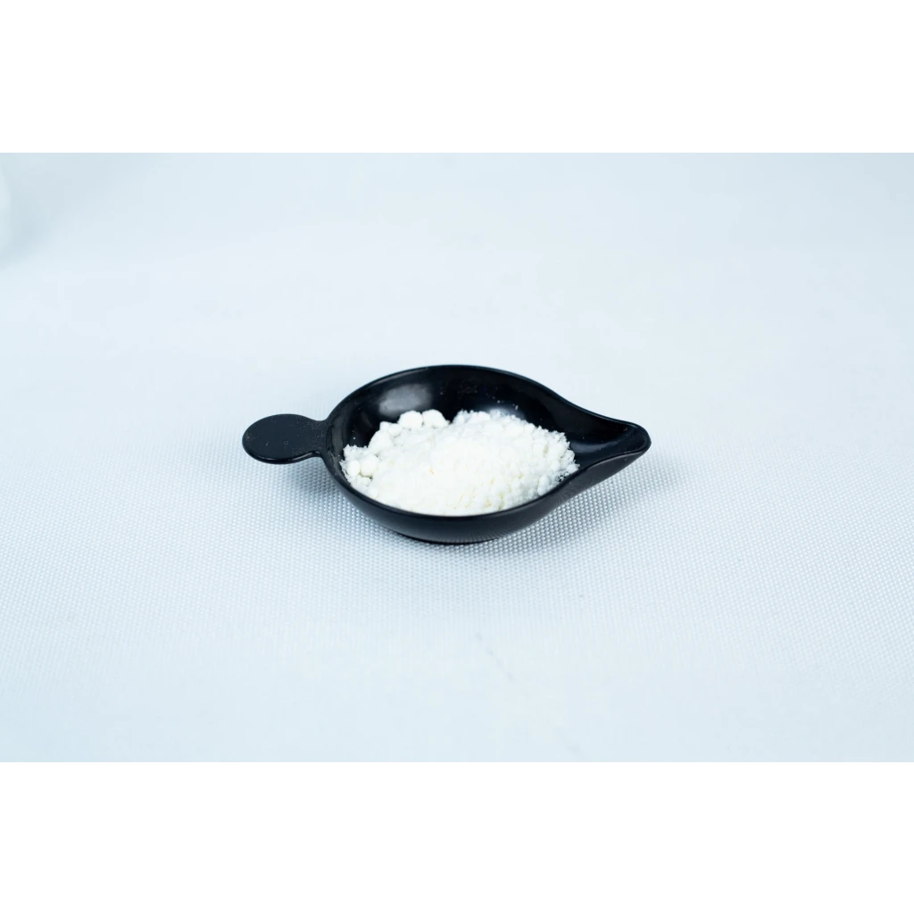 A small black dish holds Antibacterial Powder for mushroom cultivation, seen as a fine white substance on a plain white surface.