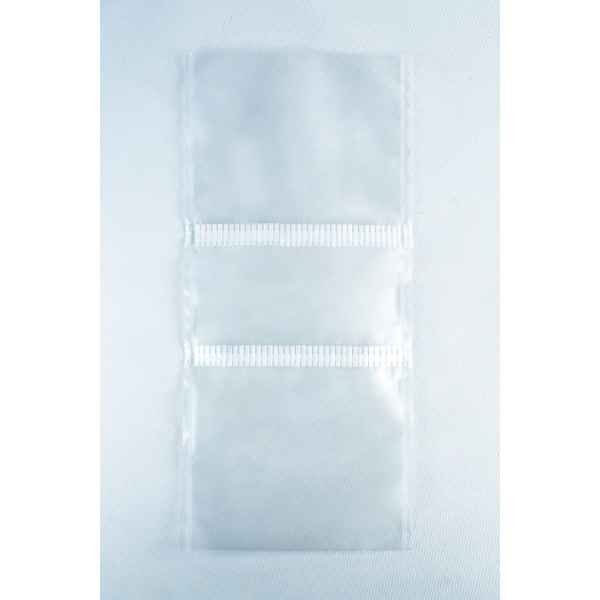 Three empty Unicorn Mushroom Grow Bags for spawn and substrate, made of transparent plastic with horizontal seals, are laid flat on a white background.