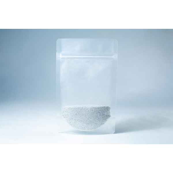 A clear resealable bag containing small white Natural Gypsum coarse grade pellets, used as a mushroom supplement for grain and substrate, is shown on a light blue background.