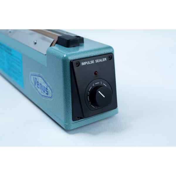 A close-up of the Heat Sealer 30cm Seal Width 5mm with cutter showcases the precision and durability of this essential machine.