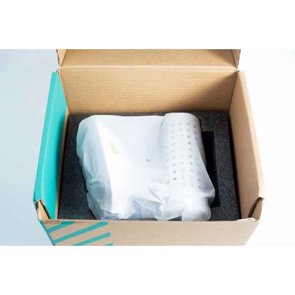 An Infrared Steriliser Bacti Cinerator Lab tool, white and wrapped in plastic, is placed inside a cardboard box with protective foam.