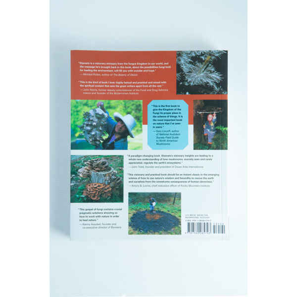Back cover of Mycelium Running: How Mushrooms Can Help Save the World by Paul Stamets, with mushroom and foraging images plus review blurbs—ideal for mycology enthusiasts and admirers of Paul Stamets’ work.