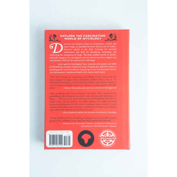 Back cover of "The Mycocultural Revolution" by Peter McCoy, in red, with summary, barcode, and publisher logos—ideal for mycology enthusiasts.