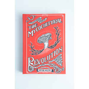 The Mycocultural Revolution: Book by Peter McCoy is a red mycology book featuring an illustrated mushroom on the cover.