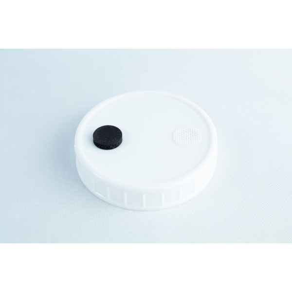The Self-healing injection port & Air Vent Filter-3M is a white plastic lid with a black self-healing injection port and a small white air vent filter on top, shown against a light background.