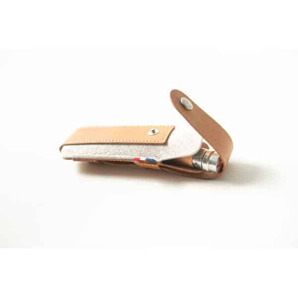 A brown Opinel Sheath, crafted from leather and felt with a press-stud fastening, is partially open to reveal a metal object inside.