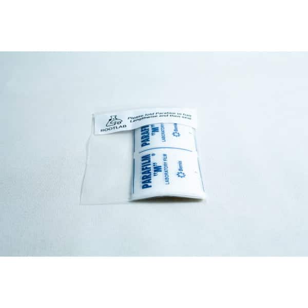 A packet of Pre-cut Parafilm strips 10x Lab cut film in clear packaging displayed on a white surface.