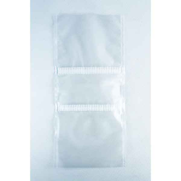 Two empty, clear Mushroom Grow Bags Unicorn for spawn and substrate are joined by a perforated line and placed on a plain white surface.