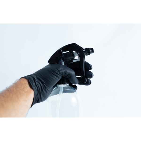 A hand in a black glove holds the Spray bottle Chemical resistant 1 Litre Heavy Duty against a plain white background.