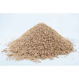 A mound of vermiculite, grade 2, fine, mycology rests on a white surface.