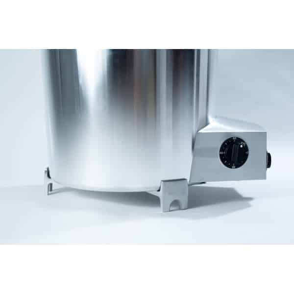 Close-up of a stainless steel appliance with a black dial on a grey base, set against a light background.