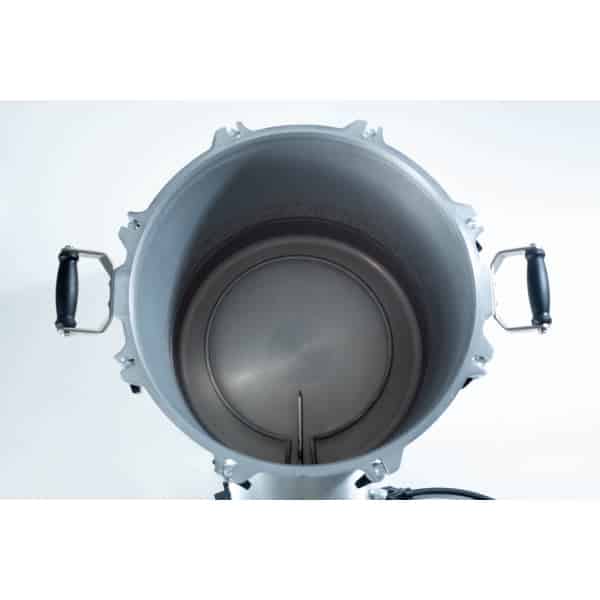 Top view of an empty metal brewing kettle with black handles on each side.