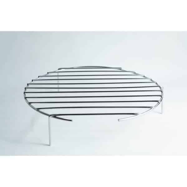 Round metal grill rack with three legs, standing on a white surface, photographed against a plain background.
