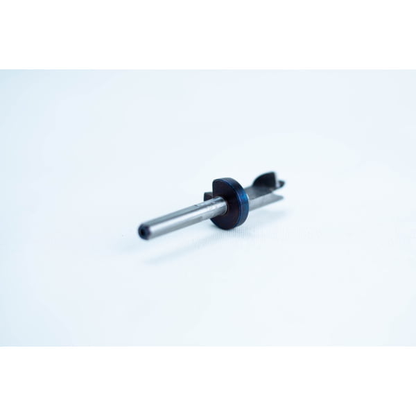 A small metal and plastic mechanical part on a white background.