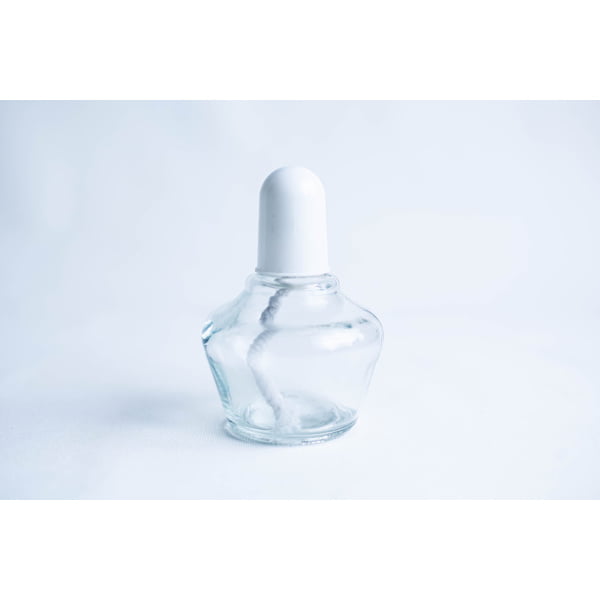 Clear glass bottle with a white cap and a visible cotton bud inside, set against a light background.
