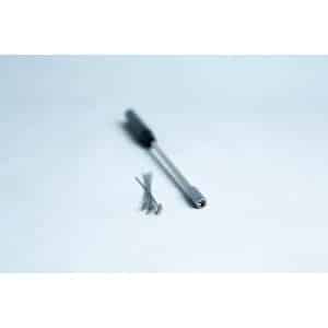 A precision screwdriver and several small screws on a white surface.