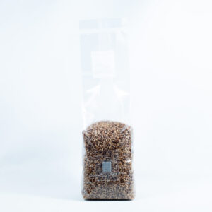 A clear plastic bag of Rye Grain Organic Pre-Sterilised for mushroom cultivation with injection port and air filter stands upright against a white background.