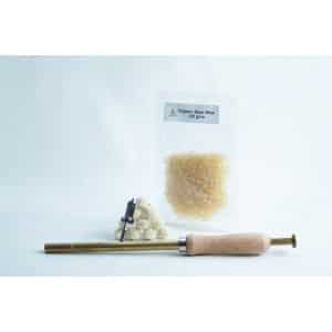A packet of organic beeswax, wax pellets, and a wooden-handled wax sealing tool on a white background.