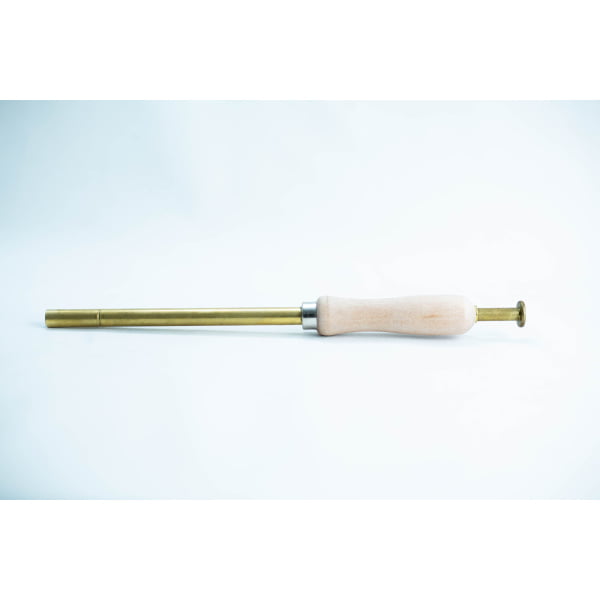 A brass and wood tool with a cylindrical handle and narrow metal shaft on a white background.