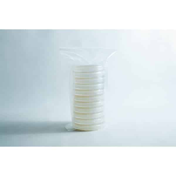 A stack of clear petri dishes wrapped in a plastic bag on a plain white background.