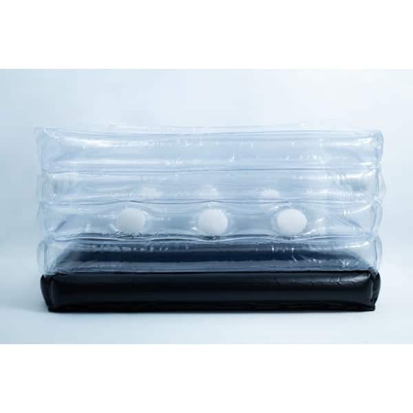 Clear inflatable plastic packaging with white foam balls inside and a black base, set against a plain background.