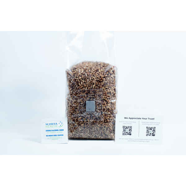 A sealed bag of grains for the Monotub Mushroom Growing Kit–Premium, accompanied by a packet and a card displaying QR codes, is placed beside it on a white background.