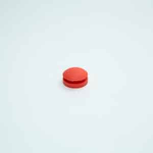 A single round orange pill, resembling an All American rubber overpressure plug for steriliser (Part 1010), is centred on a plain white background.