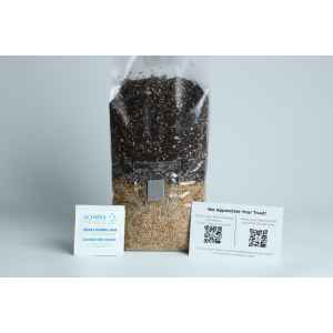 A bag of soil and seeds, an alcohol swab sachet, and a card with QR codes on a white background.