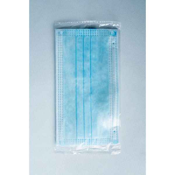A Disposable Face Mask/Unit Individually wrapped in transparent plastic packaging is displayed on a light background.