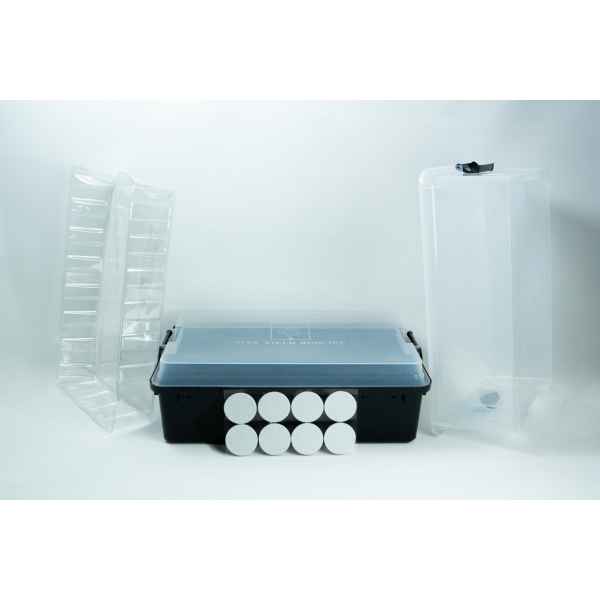 A plastic tub, two clear trays, eight round discs, and a tall clear container on a white background.