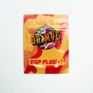 A vibrant packet of DRMyc Adaptive Liquid Culture Premix features a mushroom graphic on yellow and red, emphasising its adaptive formula.