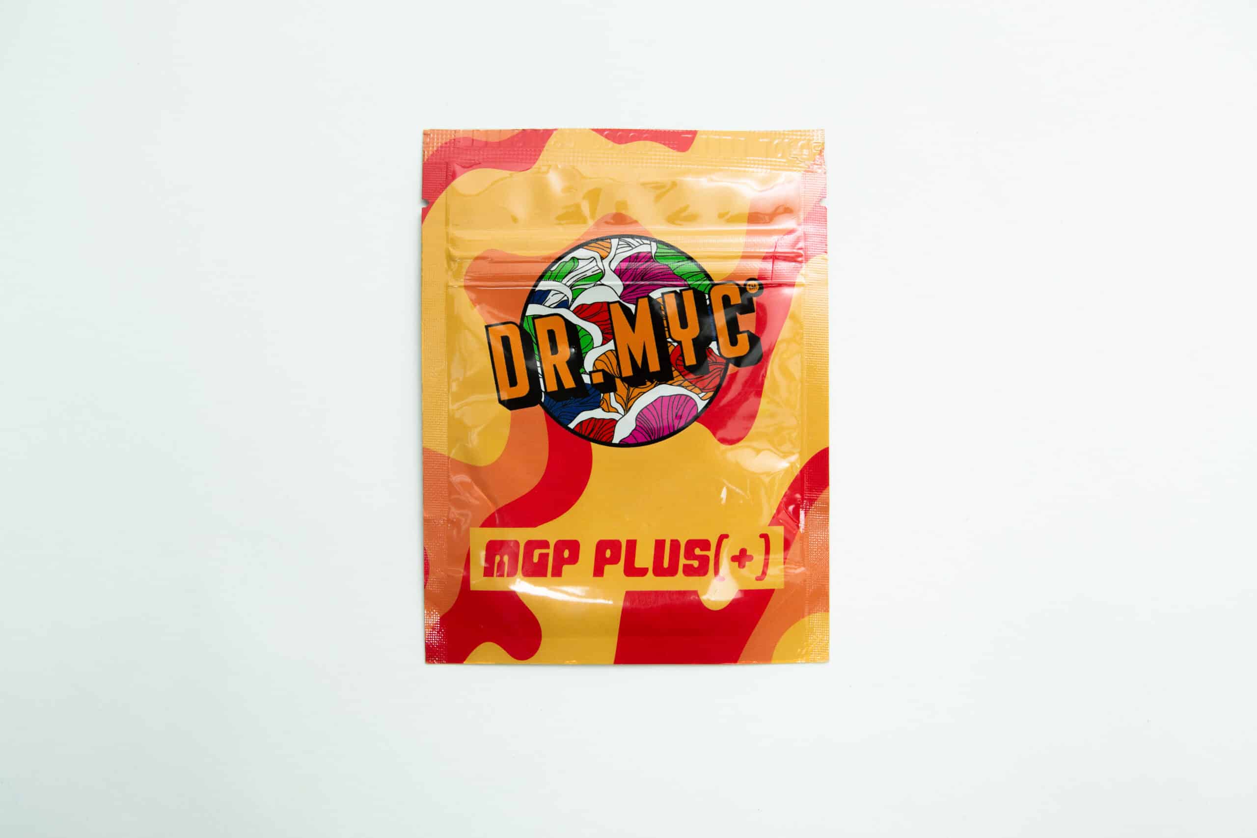 DRMyc MGP Plus - Growth Promotion + Substrate Vitality 1 A vibrant packet of DRMyc Adaptive Liquid Culture Premix features a mushroom graphic on yellow and red, emphasising its adaptive formula.