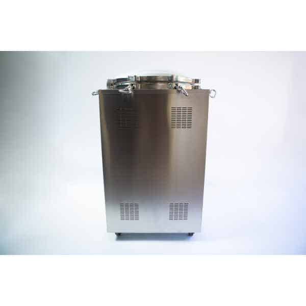 Stainless steel industrial autoclave with a closed lid and ventilation grilles, standing on a white background.