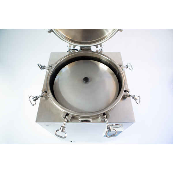 Open stainless steel autoclave with lid lifted, showing the circular inner chamber and locking clips.