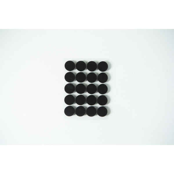 Twenty black circular dots arranged in a 4 by 5 grid on a white background.