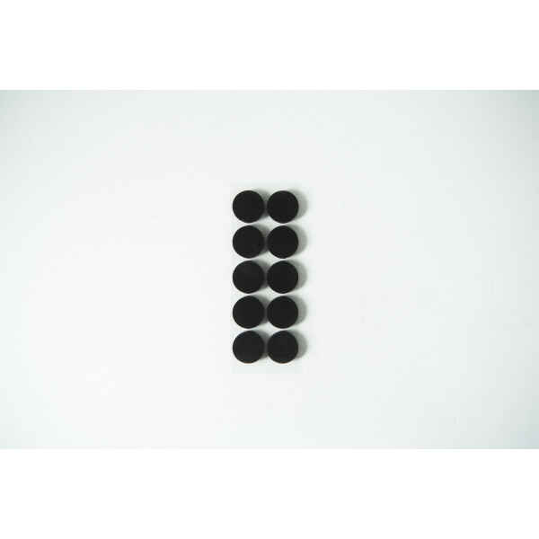 Ten small black circular pads arranged in two columns on a white background.