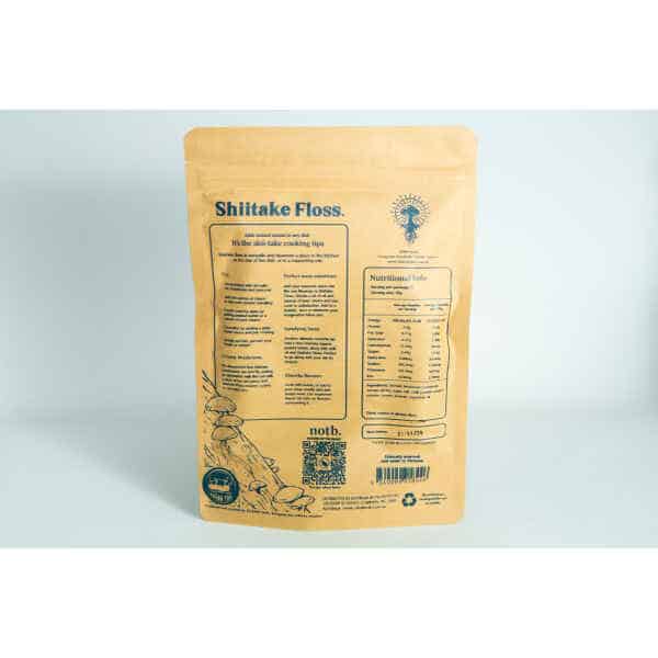 A brown parcel labelled "Shiitake Mushroom Floss | Vegan" featuring product information, cooking tips, and nutritional facts on the reverse.
